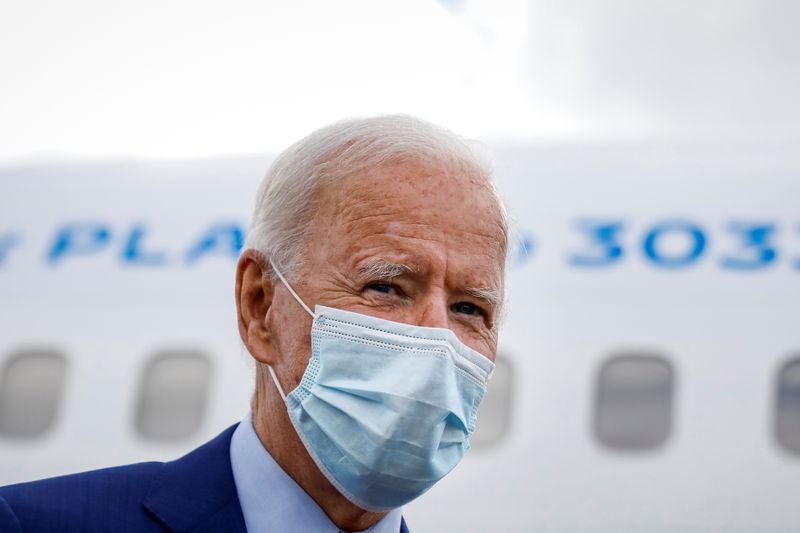U.S. Democratic presidential candidate Joe Biden boards his campaign plane