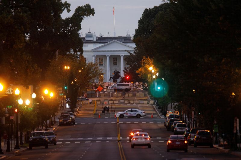 The White House is seen at sunrise from Scott Circle