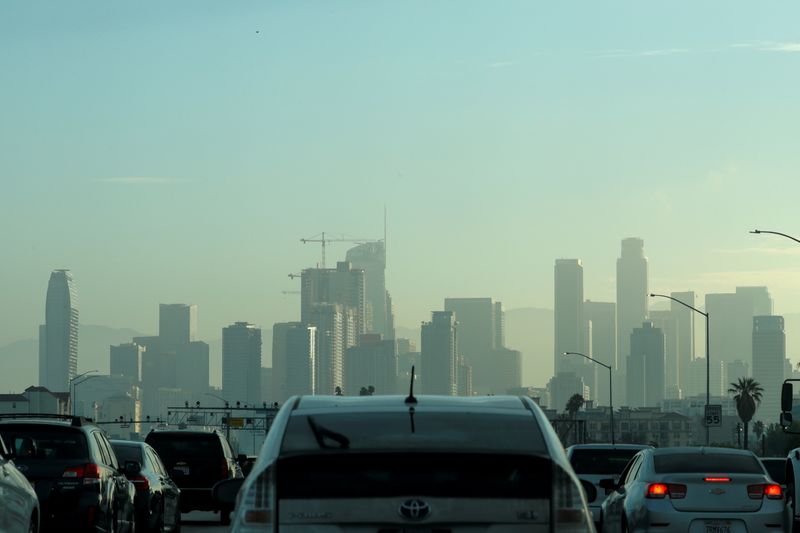 FILE PHOTO: Commuters navigate early morning traffic as they drive
