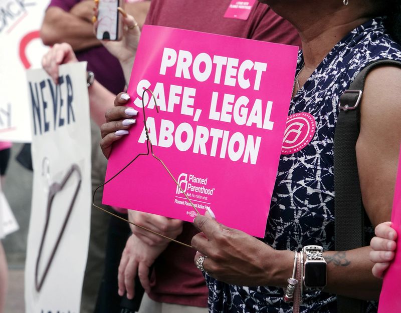FILE PHOTO: An abortion rights activist holds a sign in