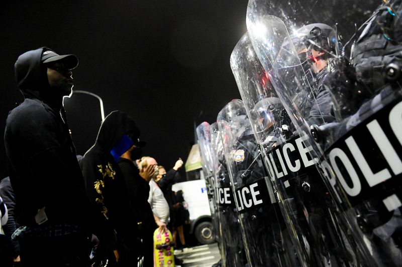 Demonstrators clash with riot police during a rally after the