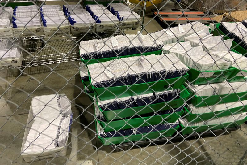 FILE PHOTO: Mailed election ballots are stored before counting at