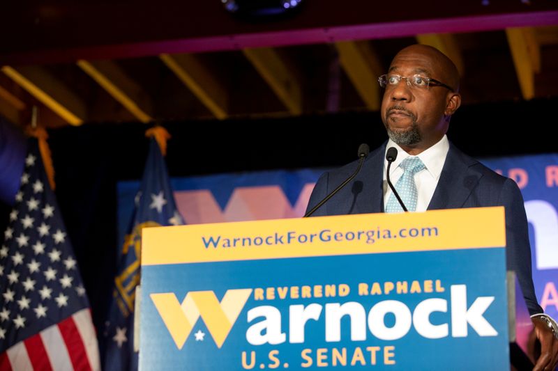 FILE PHOTO: Democratic U.S. Senate candidate Rev. Raphael Warnock holds