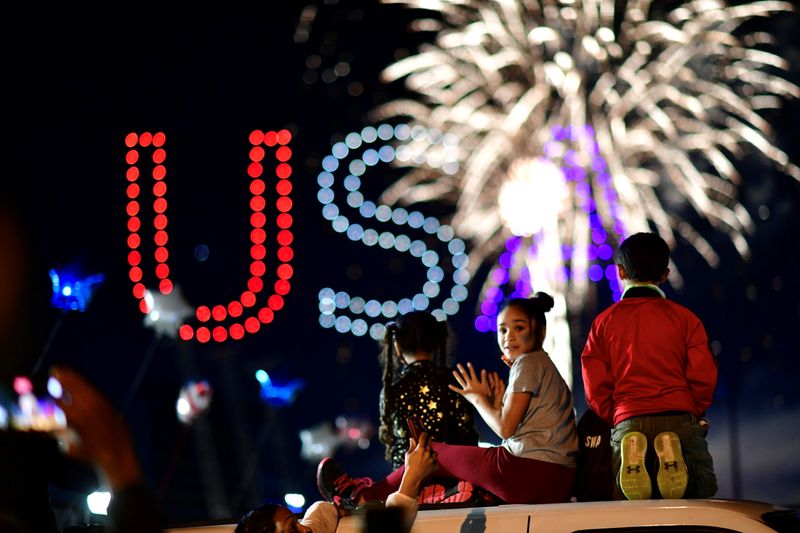 People watch fireworks after media announced that Democratic U.S. presidential