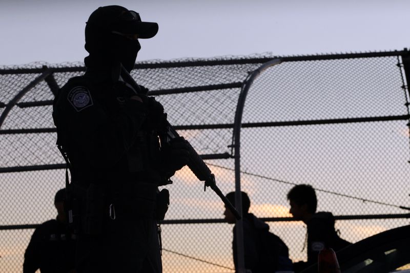 A U.S Custom and Border Protection agent guards one of