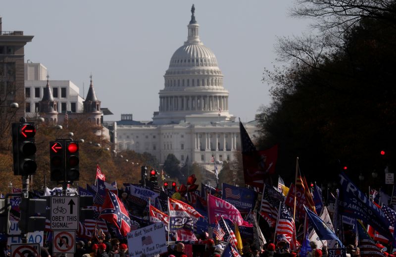FILE PHOTO: People participate in rallies in support of U.S.