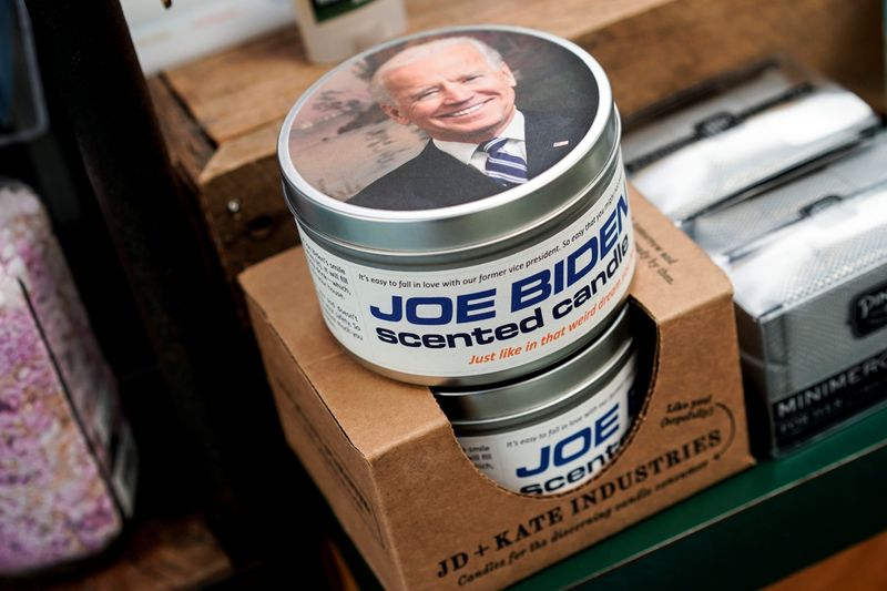 Candles with the image of President-elect Joe Biden are shown
