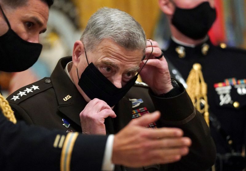 FILE PHOTO: Milley puts his mask back on after U.S.