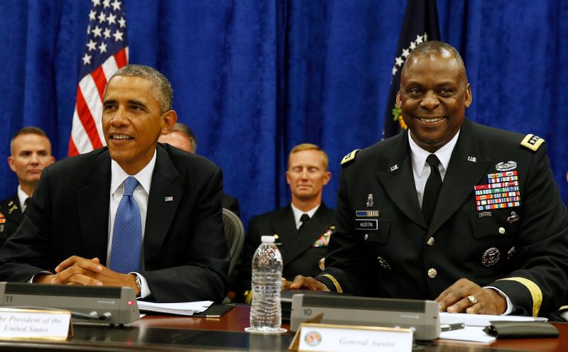 U.S. President Barack Obama sits next to Commander of Central