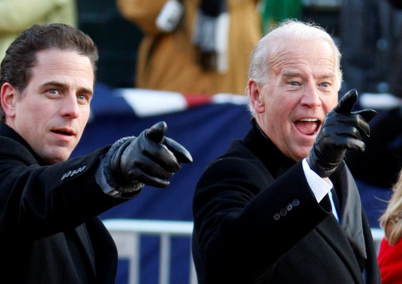 FILE PHOTO: U.S. Vice President Biden and son Hunter gesture