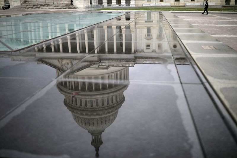 FILE PHOTO: The U.S. Capitol Building is reflected on a