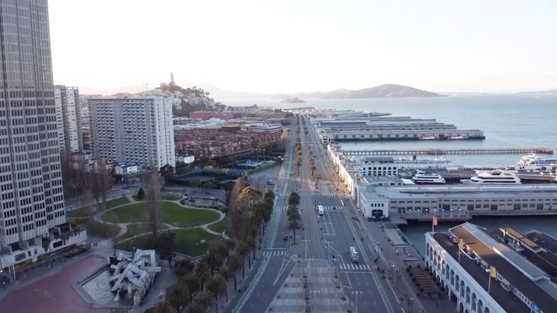 An aerial view from a drone shows virtually deserted streets