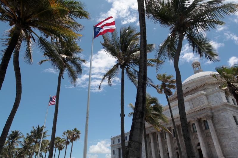 FILE PHOTO: The flags of the U.S. and Puerto Rico
