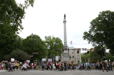 Protesters gather for a ReOpenNC rally