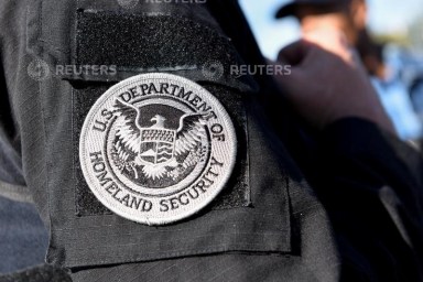 FILE PHOTO: A member of ICE and ERO Fugitive Operations