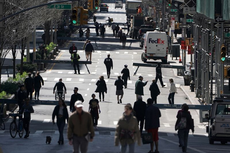 FILE PHOTO: People walk on Park Avenue that was closed
