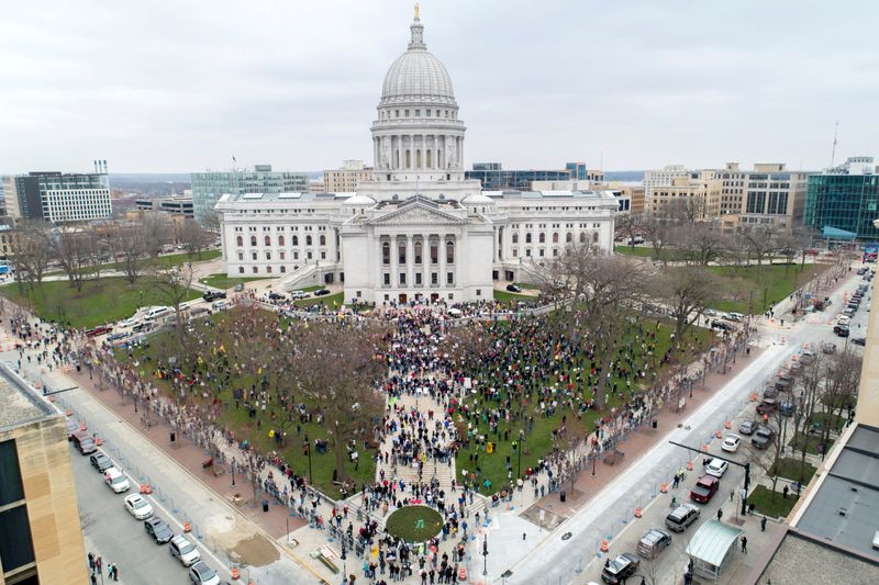 Protesters against the state’s extended stay-at-home order demonstrate in Madison