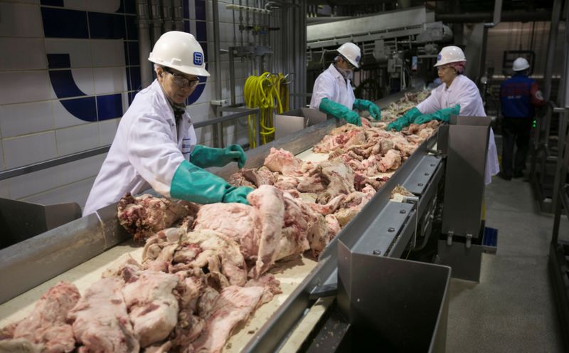 FILE PHOTO: Plant workers produce lean, finely textured beef (LFTB)