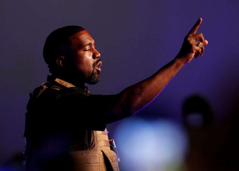 Rapper Kanye West makes a point as he holds his