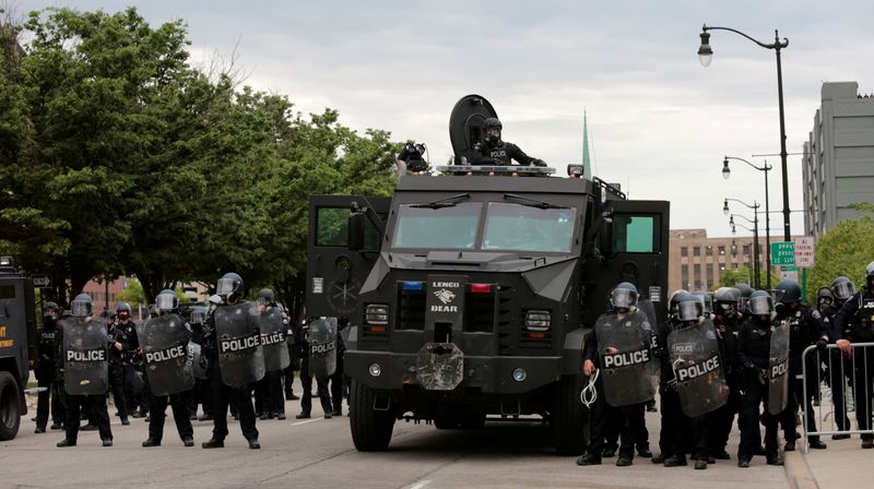 FILE PHOTO: Detroit police, wearing riot gear, line up next