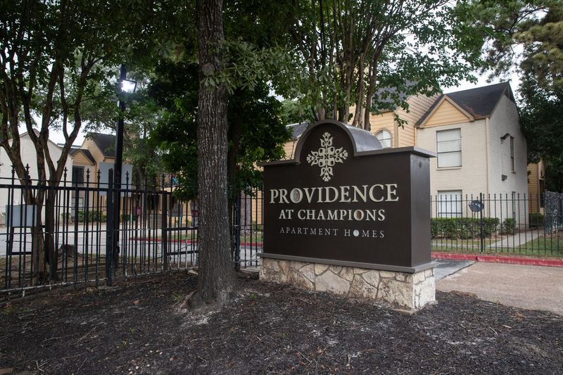 An entrance to the Providence at Champions apartment complex is