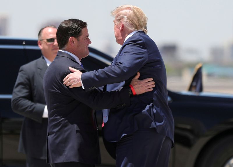 FILE PHOTO: U.S. President Trump hugs Arizona Governor Doug Ducey