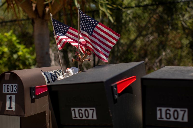 Residents decorate their U.S. postal mail boxes with U.S. flags