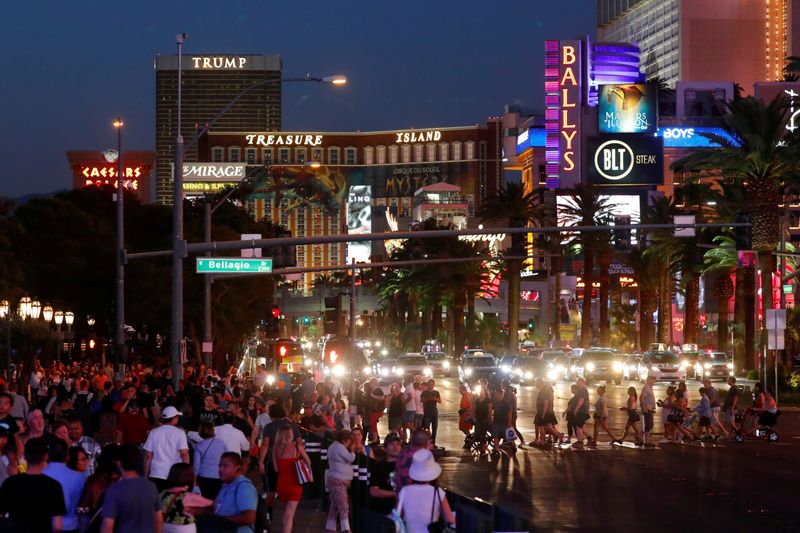 FILE PHOTO: Tourists enjoy the Las Vegas Strip as they