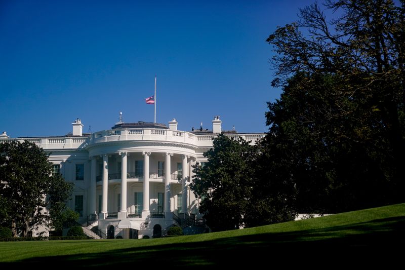 The American flag above the White House is seen at