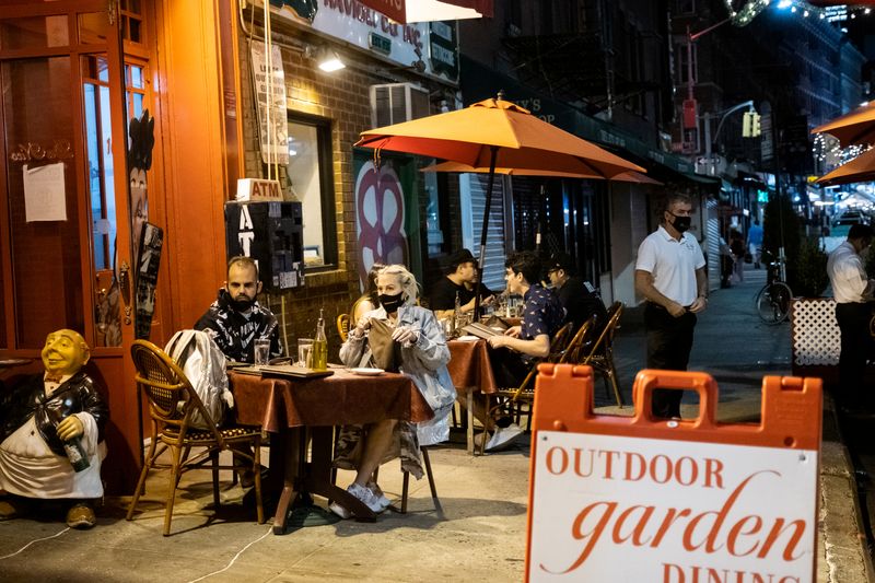 FILE PHOTO: People enjoy outdoor dining amid the coronavirus disease