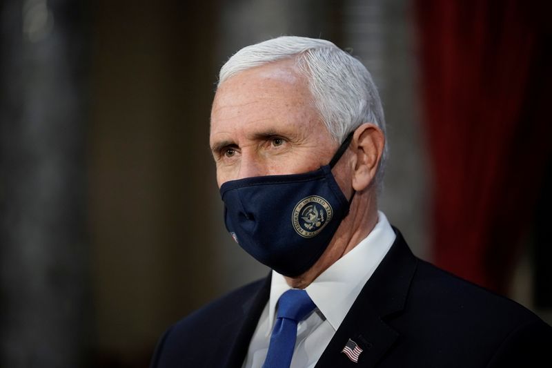 FILE PHOTO:  Vice President Mike Pence finishes a swearing-in