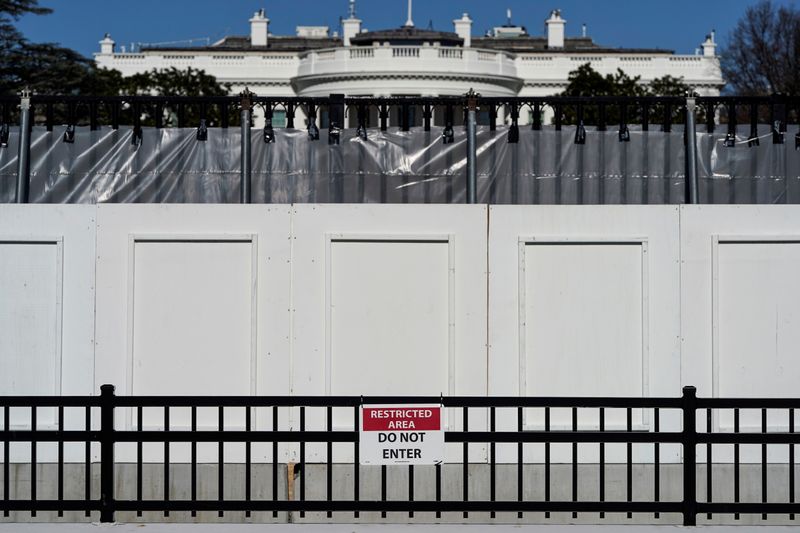 The White House is seen behind security fencing in Washington