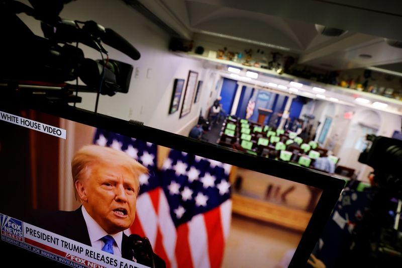 Trump makes remarks on TV monitor from White House Briefing