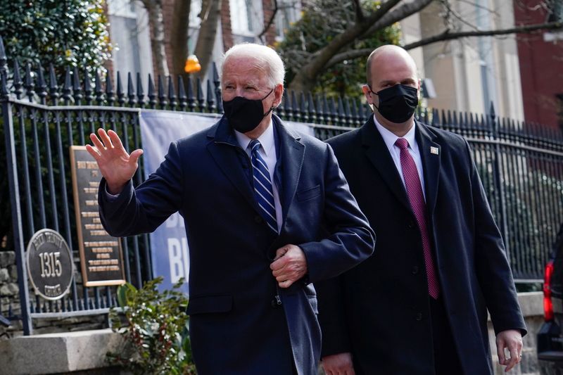 U.S. President Joe Biden gestures as he leaves the Holy
