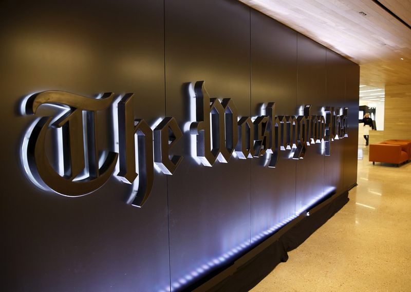 Newspaper banner logo is seen during grand opening of Washington