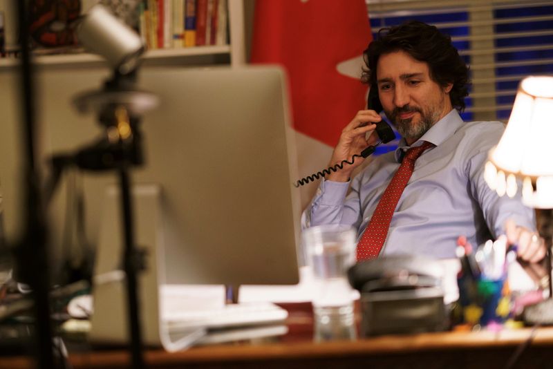 Canada’s Prime Minister Justin Trudeau speaks on the phone with