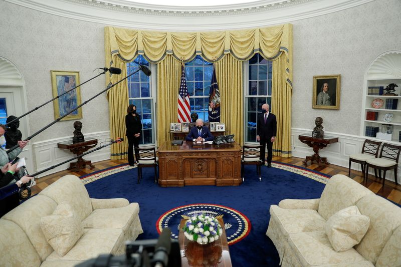 FILE PHOTO: U.S. President Joe Biden signs executive orders on