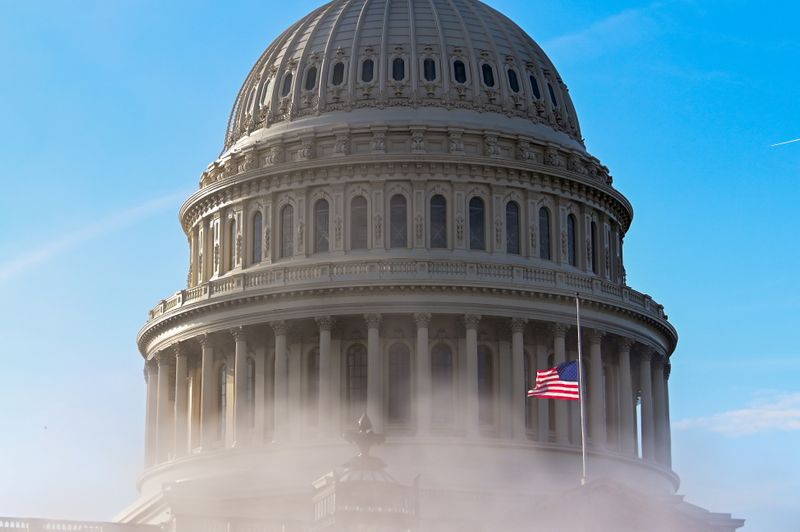 The U.S. Capitol dome is seen through steam as the