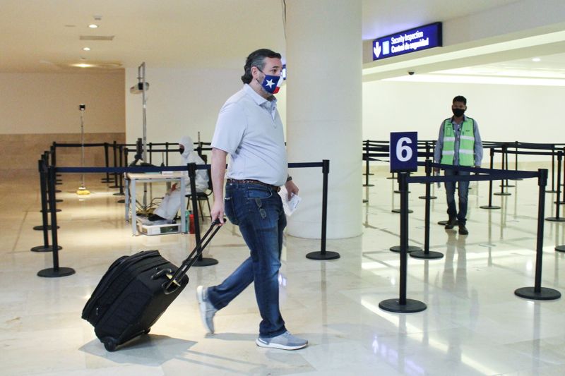U.S. Senator Ted Cruz (R-TX) carries his luggage at the