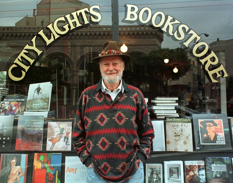 FILE PHOTO: Lawrence Ferlinghetti stands outside his bookstore in San