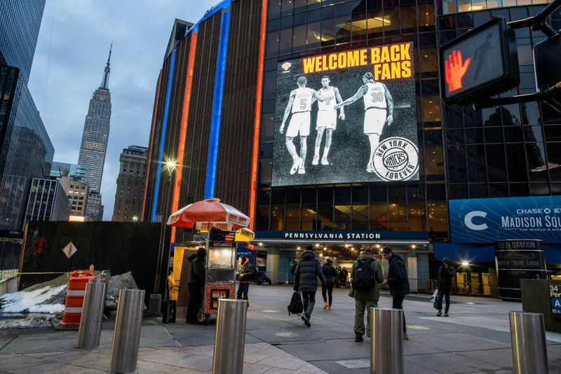 People walk outside Madison Square Garden before a Knicks game