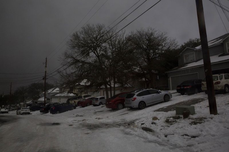 A neighborhood experiences a power outage after winter weather caused