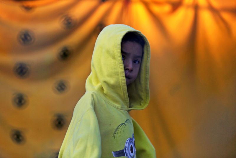 FILE PHOTO: A migrant child who is seeking asylum in