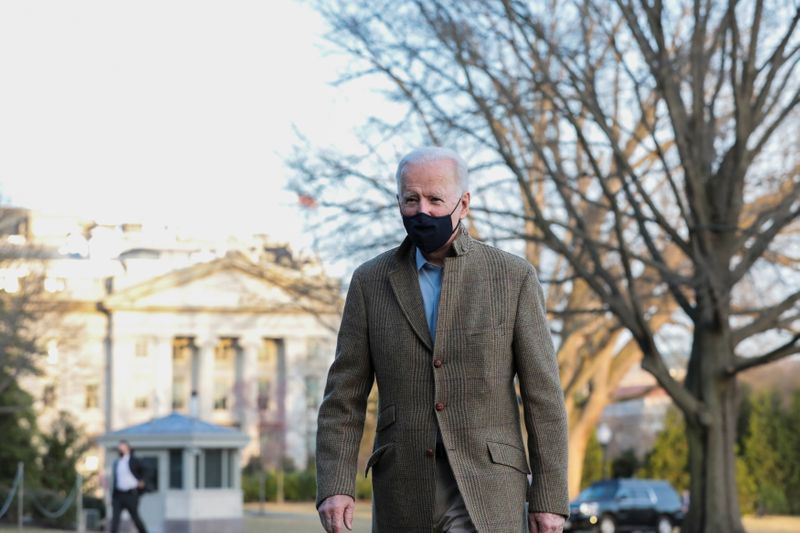 U.S. President Joe Biden walks across the South Lawn of