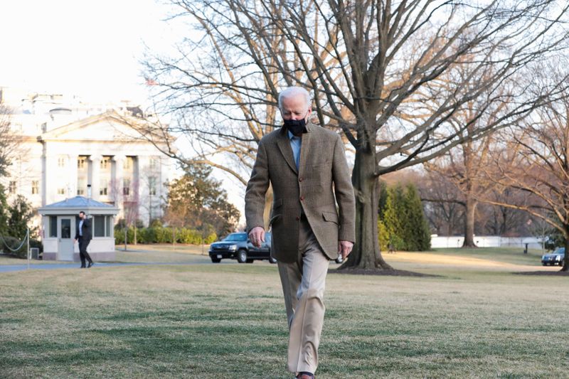 U.S. President Joe Biden walks across the South Lawn of