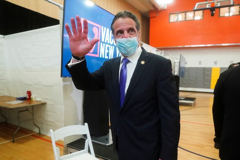 FILE PHOTO: New York Governor Andrew Cuomo waves goodbye as
