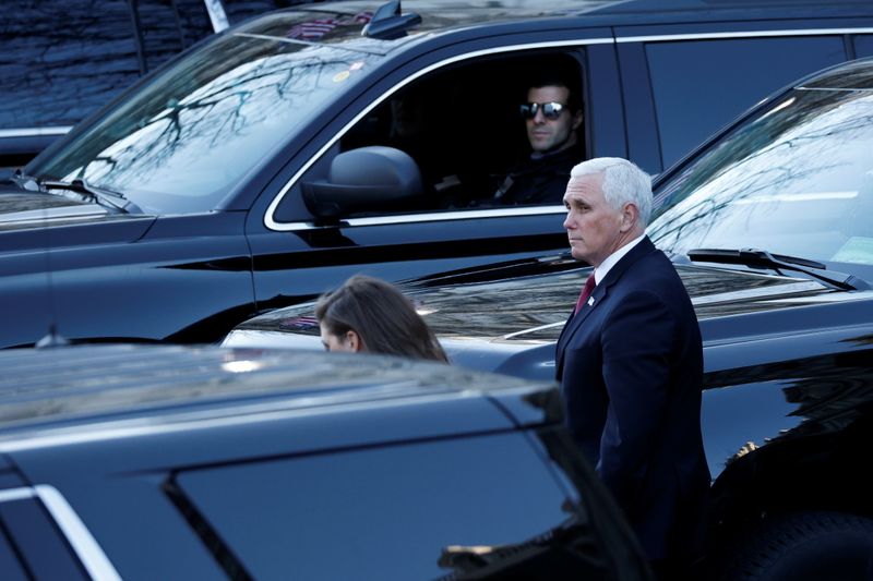 Pence walks into the West Wing of the White House