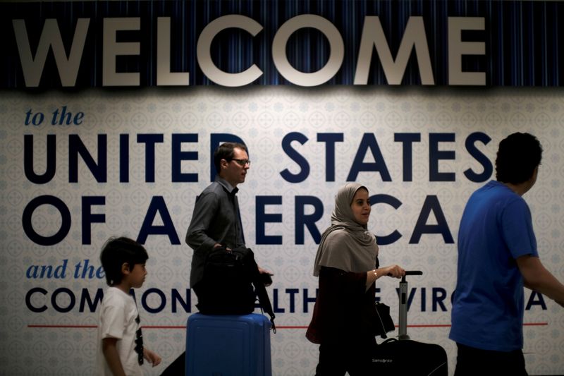 FILE PHOTO: International passengers arrive at Washington Dulles International Airport