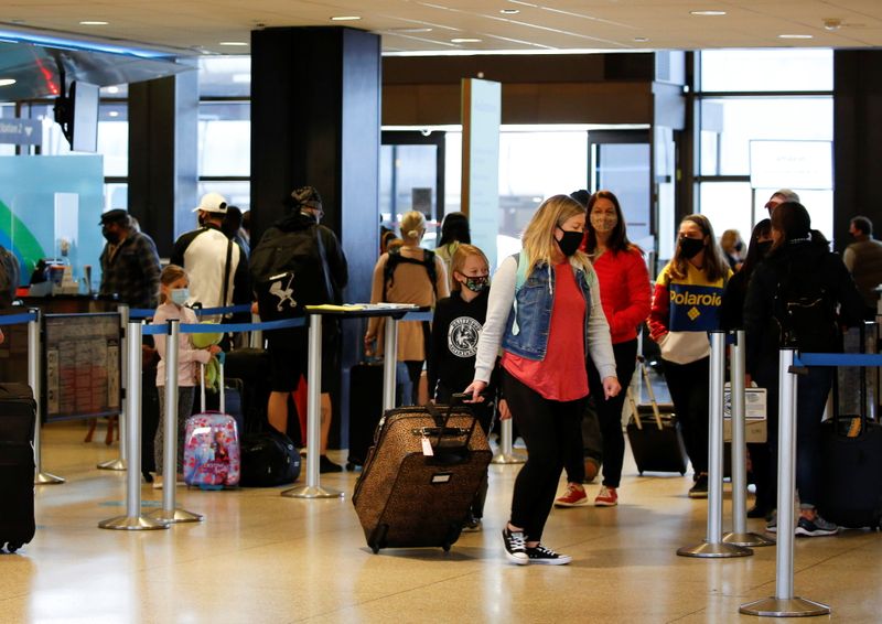 FILE PHOTO: Travelers at Seattle-Tacoma International Airport in SeaTac