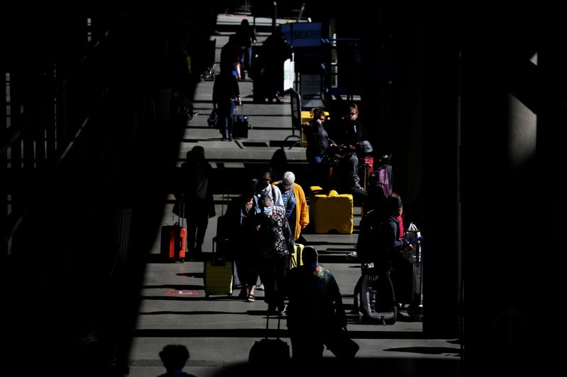 FILE PHOTO: Travelers at Seattle-Tacoma International Airport in SeaTac